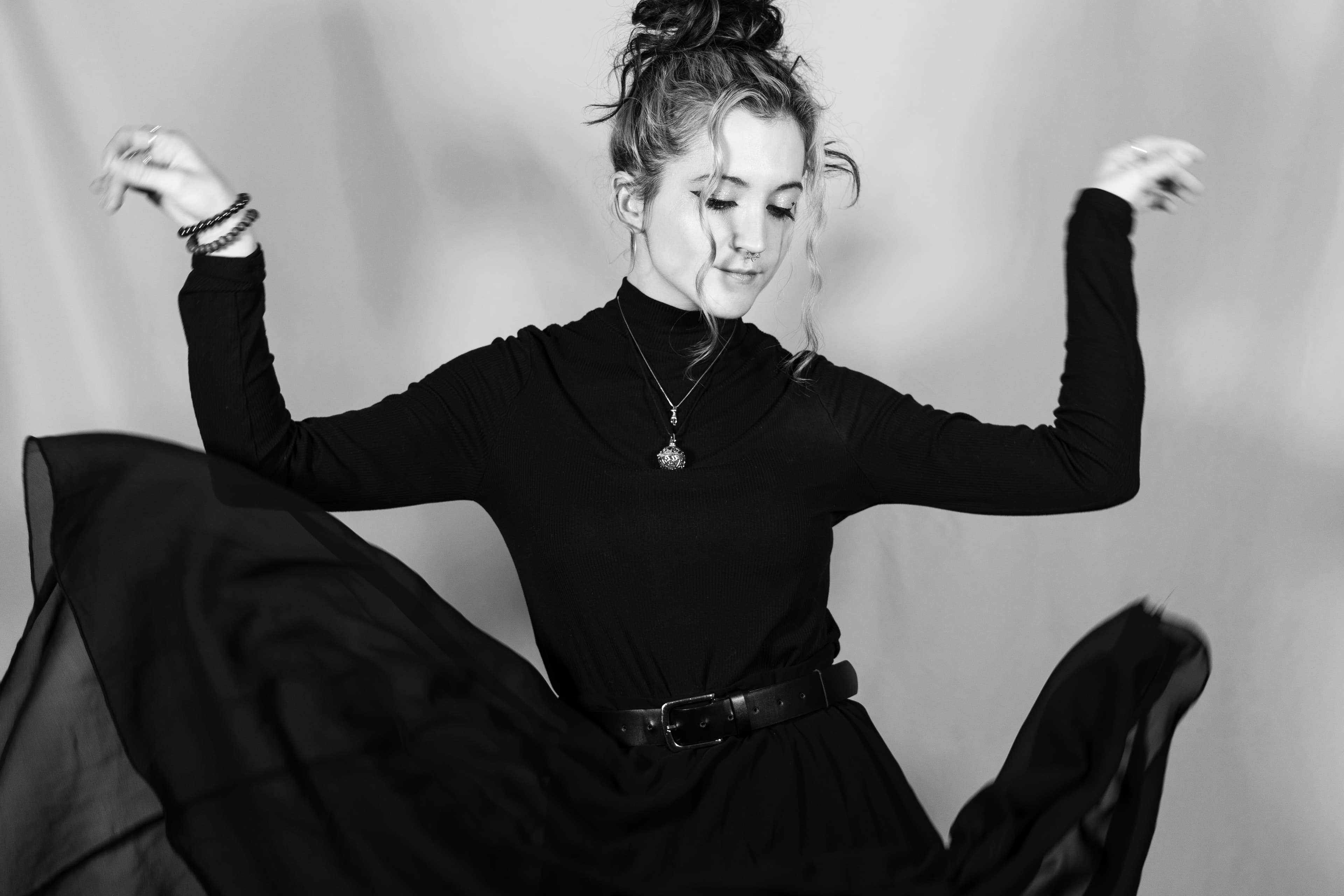 Woman dancing with arms up