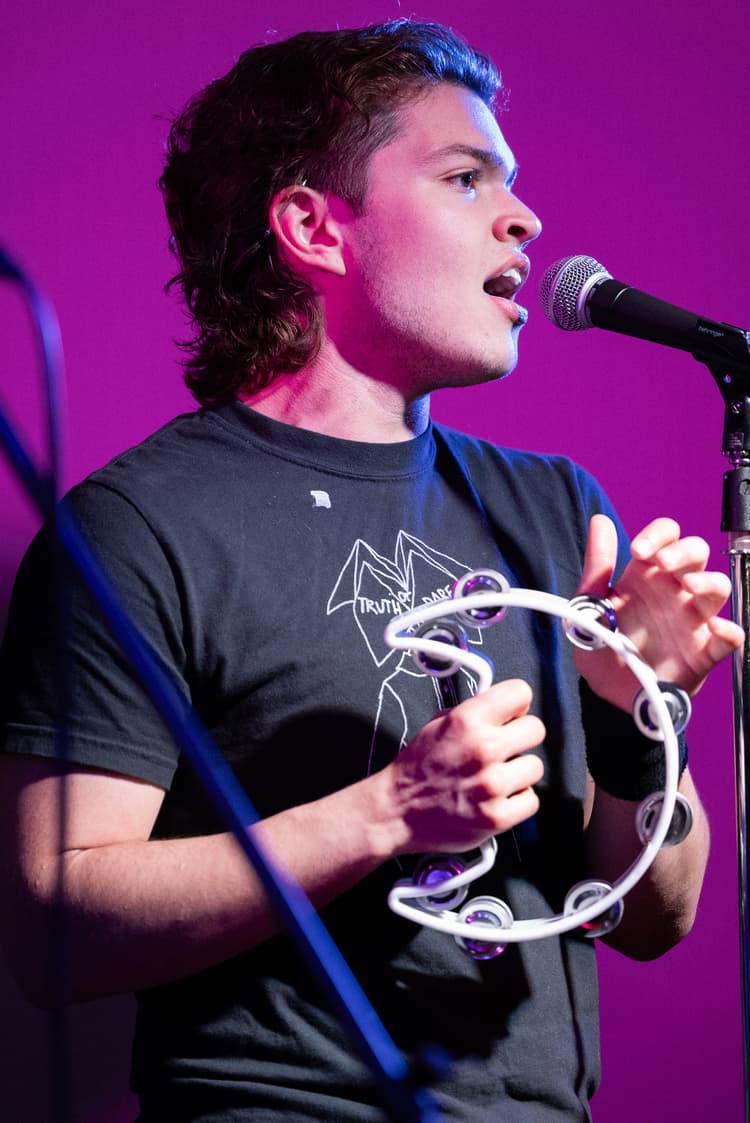 singer on the microphone of a stage